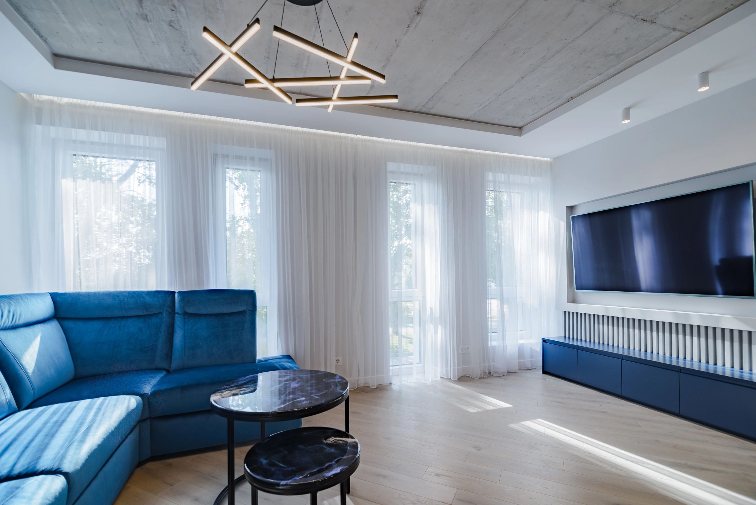 Bright modern living room with large windows