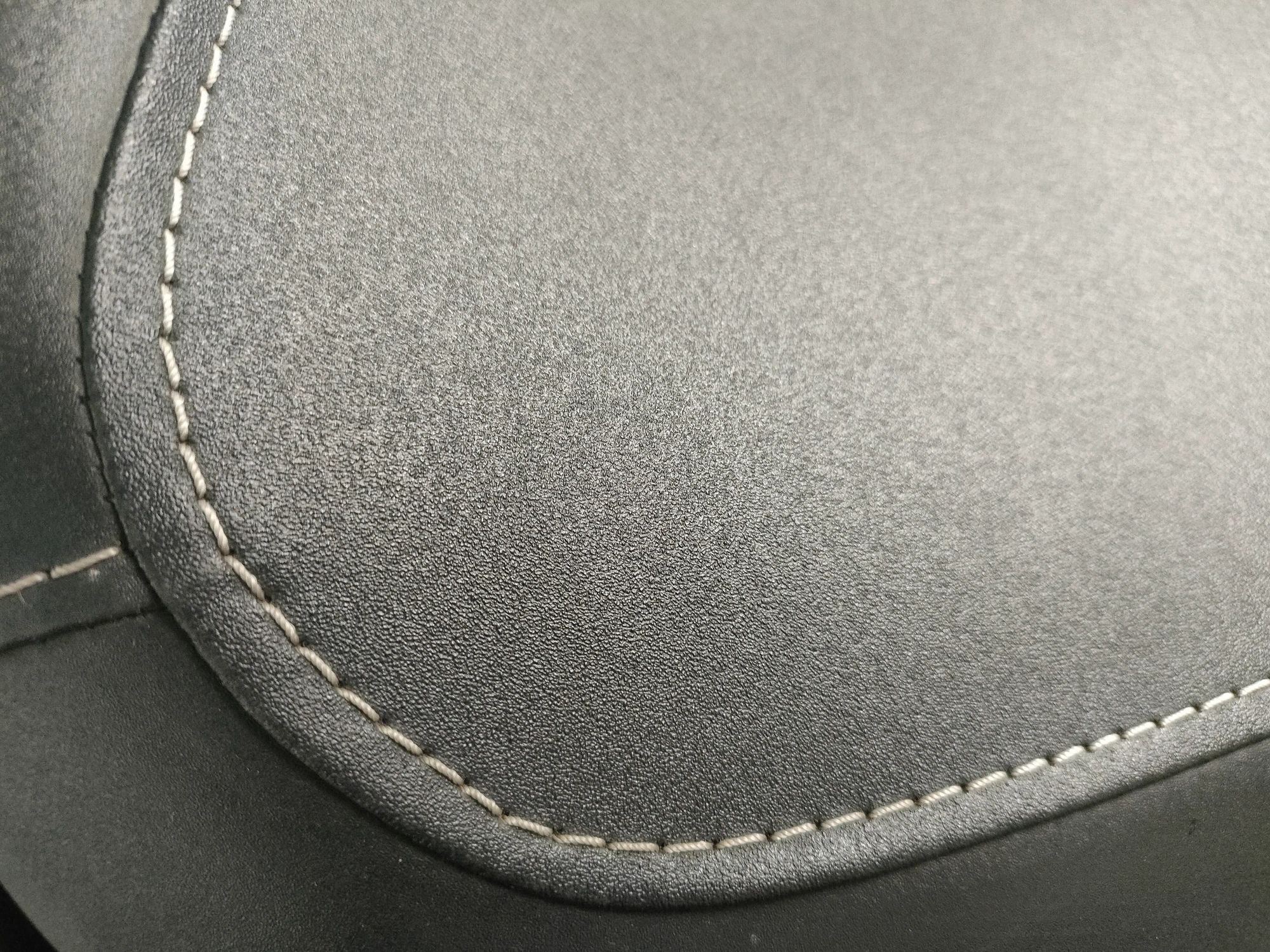 Close-up of upholstery stitching on a vehicle seat